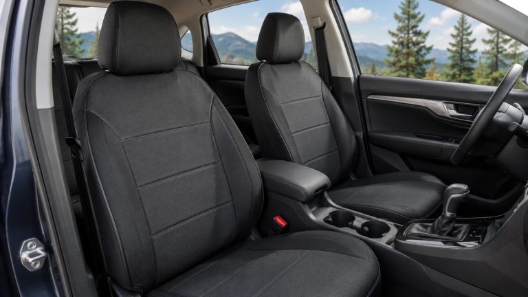 Black fitted seat covers installed in a clean modern car interior