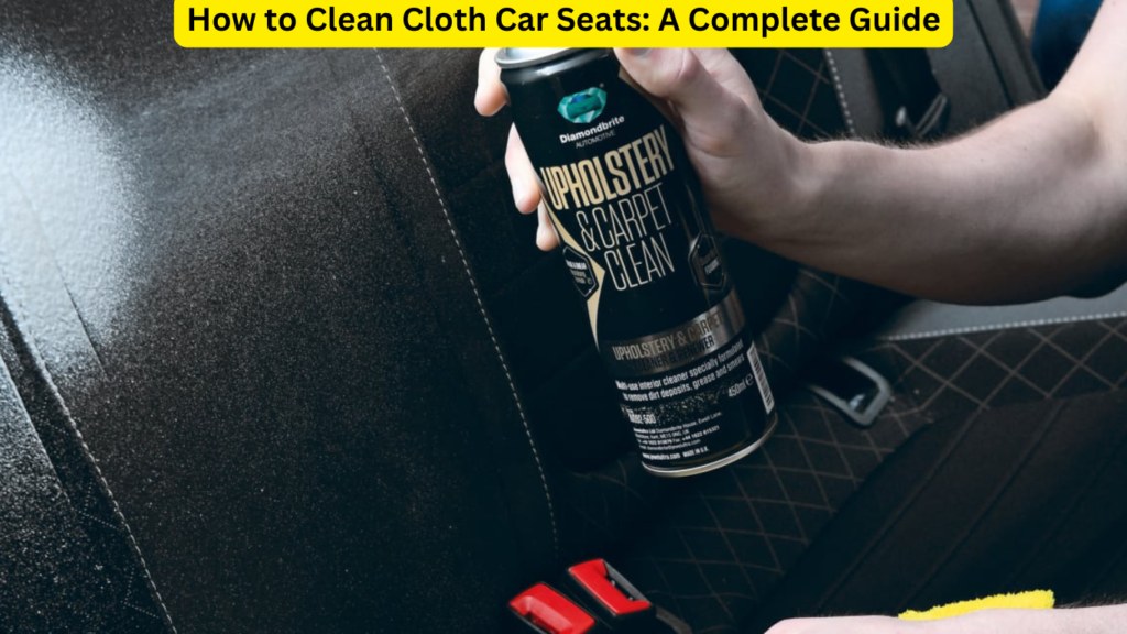 Person spraying pre-treatment cleaner onto a stained cloth car seat