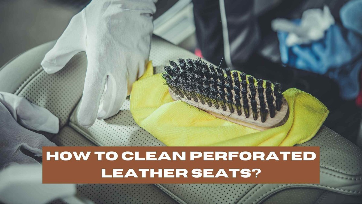 Person spraying leather cleaner onto a perforated car seat and wiping it with a microfiber cloth.